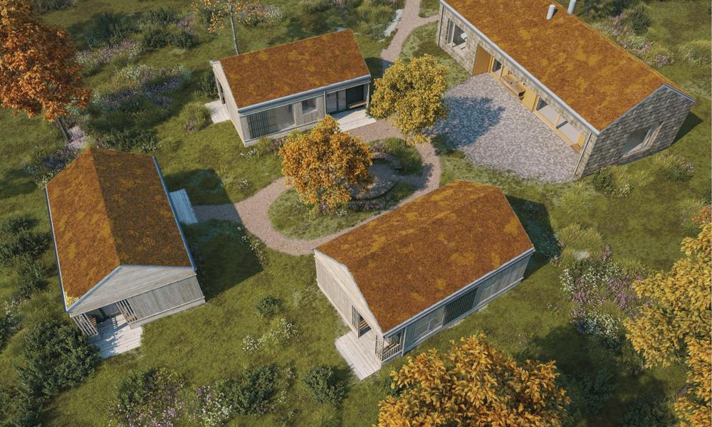 De tre tiny houses og fælleshuset i Bo i Ro set fra oven. Boligerne indvies d. 25. januar 2024.