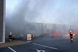 Brand i mindre butikscenter i Hjørring