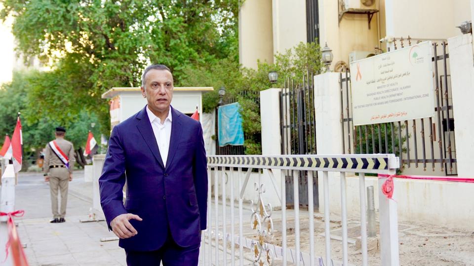 Iraqi Prime Minister Mustafa Al-Kadhimi arrives at a polling station to cast his vote, in Baghdad <i>Iraqi Prime Minister Media Office/Reuters</i>