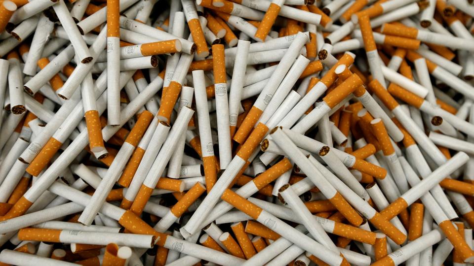 FILE PHOTO: Lucky Strike cigarettes are seen during manufacturing process in BAT Cigarette Factory in Bayreuth <i>Michaela Rehle/Reuters</i>