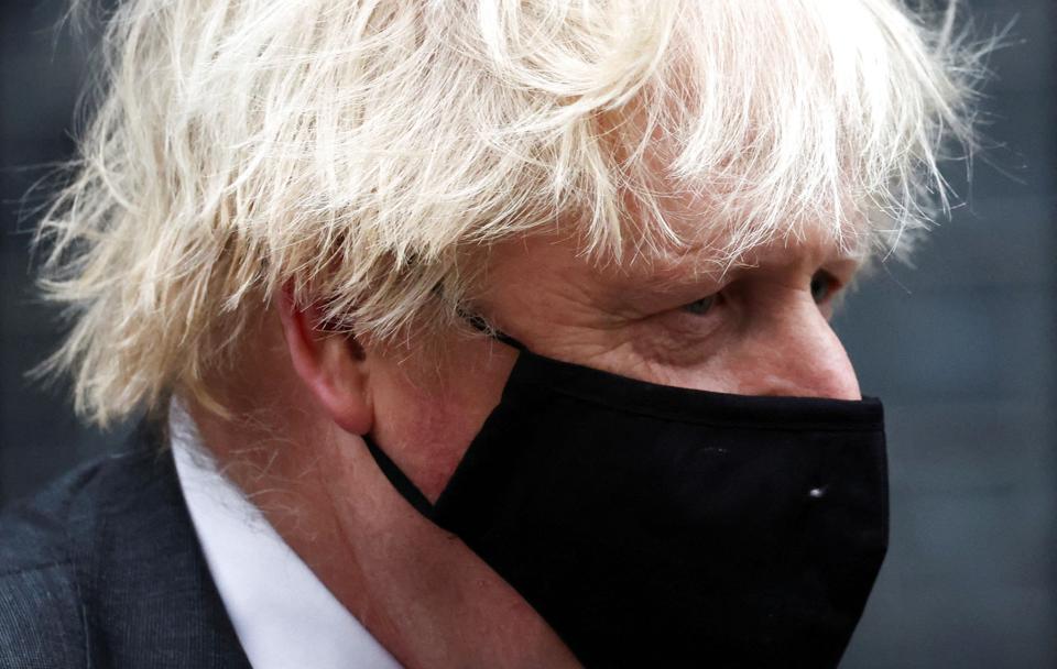 FILE PHOTO: British PM Johnson walks outside Downing Street in London <i>Henry Nicholls/Reuters</i>