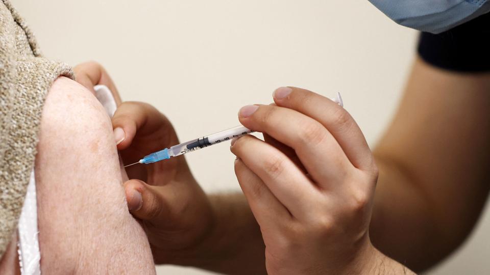 People receive COVID-19 booster vaccine in Bolton <i>Molly Darlington/Reuters</i>