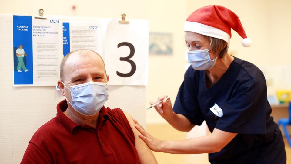 People recieve COVID-19 vaccines on Christmas Day in Eastbourne <i>Hannah Mckay/Reuters</i>
