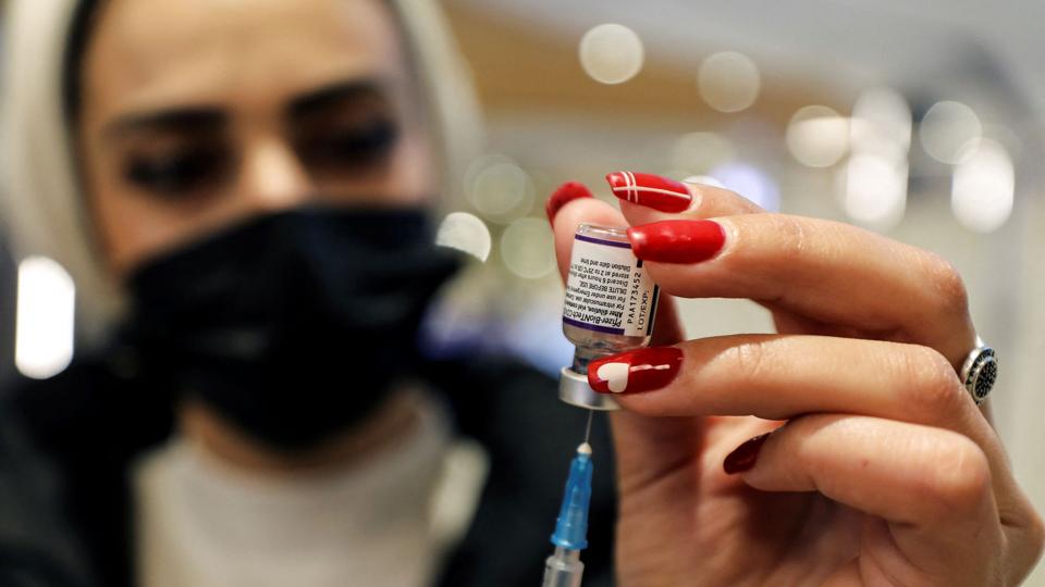 Coronavirus disease (COVID-19) vaccination campaign continues amid talks of a fourth dose for high-risk groups including those over the age of 60, in Jerusalem <i>Ammar Awad/Reuters</i>