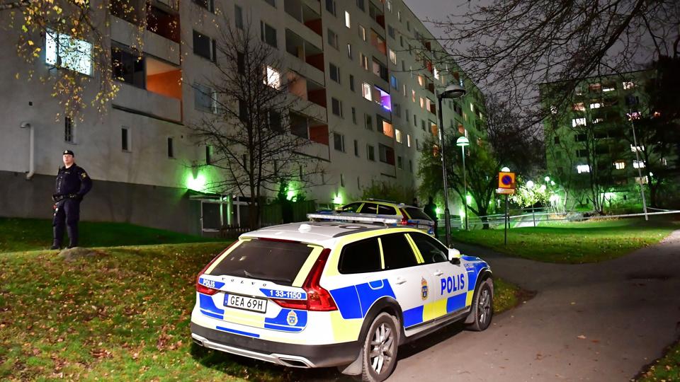 Police cars are seen in front of an apartment block following a suspected crime in Hasselby <i>Tt News Agency/Reuters</i>
