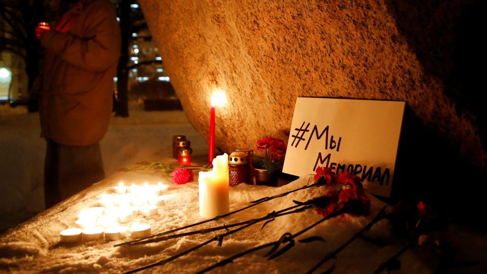 Supporters of the human rights group International Memorial gather at the Solovetsky Stone memorial in Saint Petersburg <i>Anton Vaganov/Reuters</i>