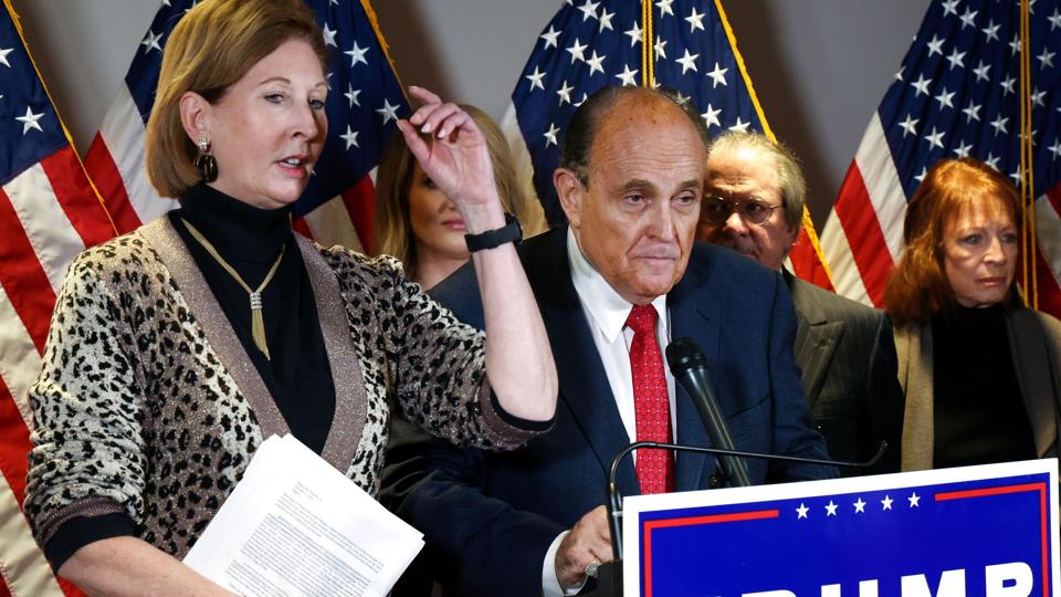 Powell participates in a news conference with Trump''s personal lawyer Giuliani on Capitol Hill in Washington <i>Jonathan Ernst/Reuters</i>