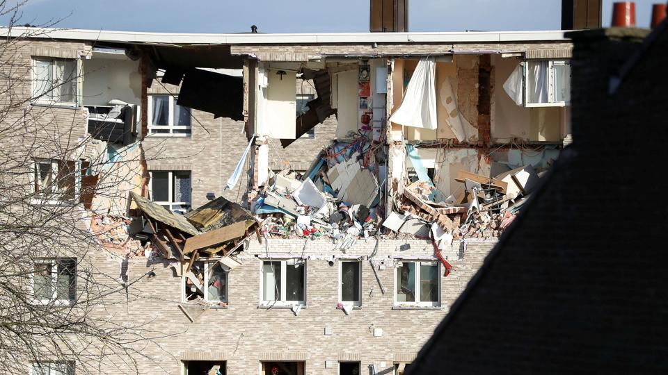 Rescue forces inspect the rubble of a building after an explosion in Turnhout <i>Johanna Geron/Reuters</i>