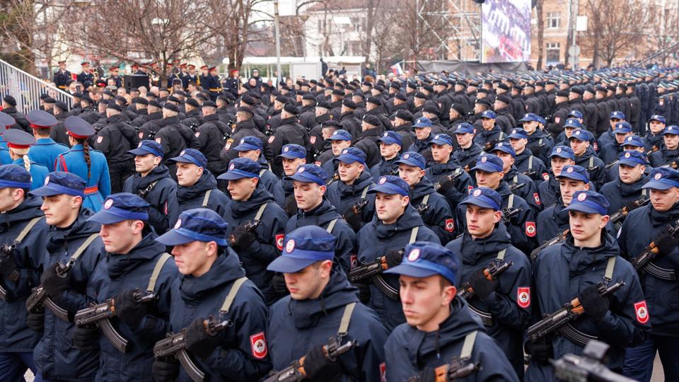 Police march during parade celebrations to mark their autonomous Serb Republic''s national holiday, in Banja Luka <i>Antonio Bronic/Reuters</i>