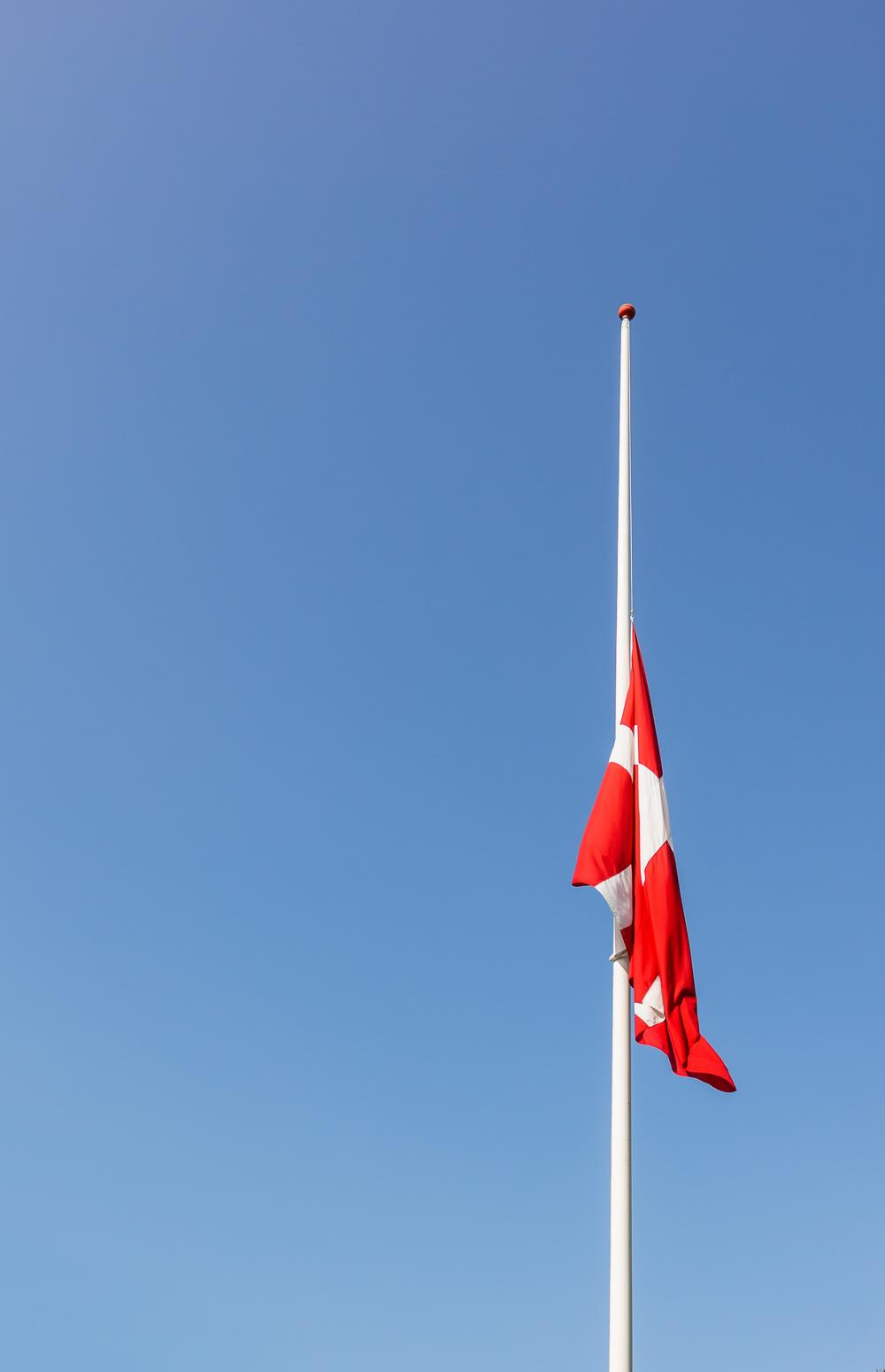 Danish flag at half-mast means death in the family or in the nation, Denmark,  August 23, 2017