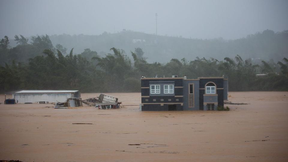 Byen Cayey i Puerto Rico blev søndag ramt af oversvømmelser forårsaget af orkanen Fiona. <i>Stephanie Rojas/Ritzau Scanpix</i>