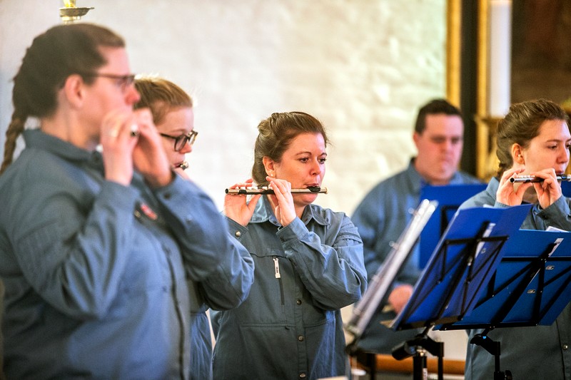 Musikkredsen udgøres dels af tamburkorpset og dels af poporkestret The Blue Ones.